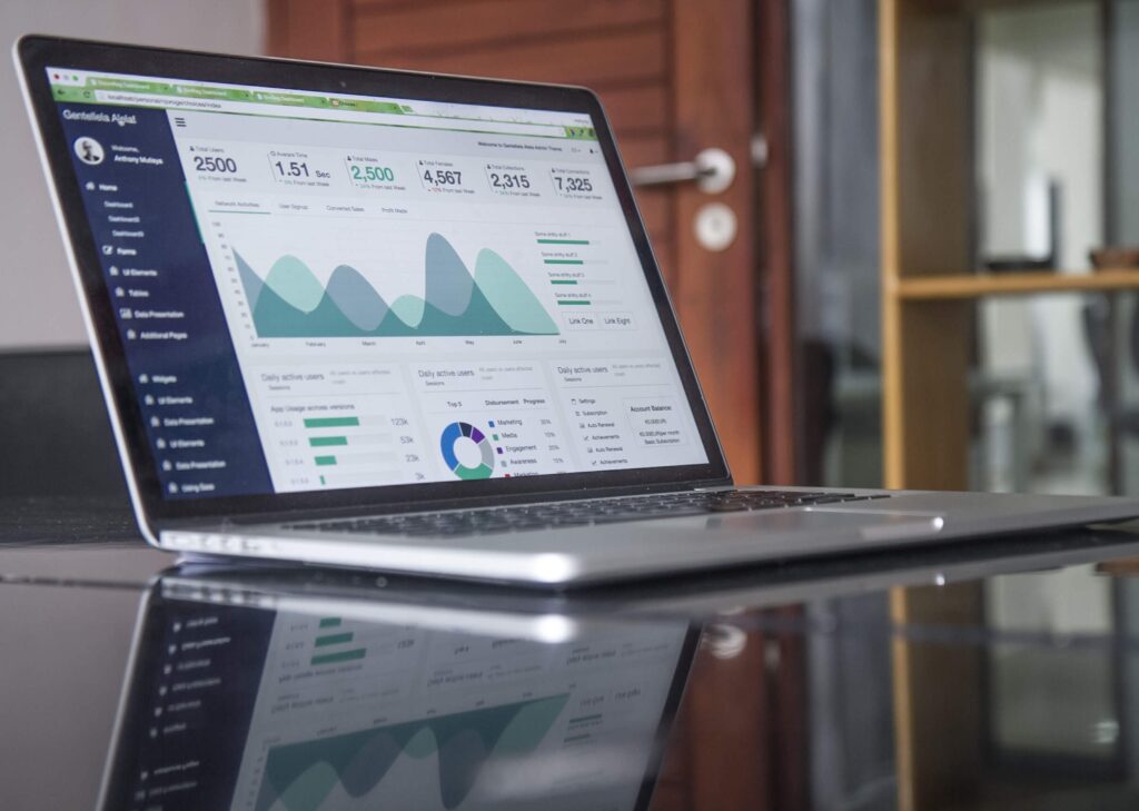 laptop with graphs and financial data